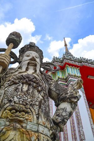 Chinese guardian figure at a gate in Wat Pho(Buddhist temple in Bangkok,Thailand)の写真素材