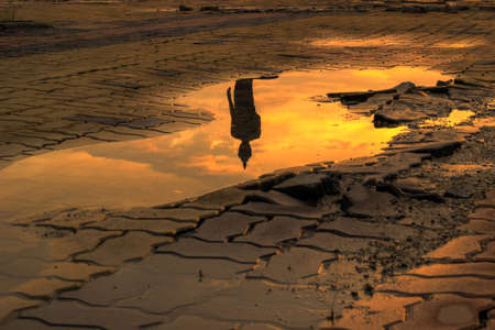 Reflection shadow of Buddha statue at Phutthamonthon (Buddhist park in the Phutthamonthon district, Nakhon Pathom Province of Thailand, west of Bangkok)の写真素材