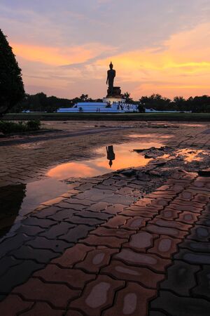 Reflection shadow of Buddha statue at Phutthamonthon (Buddhist park in Phutthamonthon district, Nakhon Pathom Province of Thailand)の写真素材
