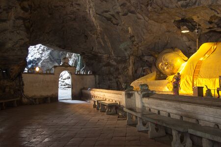 huge reclining Buddha image in Khao Luang Cave, Phetchaburi province, Thailand.のeditorial素材