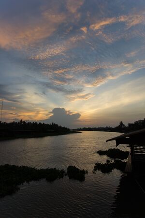 evening sky at Tha Chin river(Maenam Tha Chin),Nakhon Pathom,Thailandの写真素材