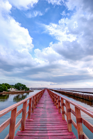 Evening at red wooden bridge near Matchanu Shrine,Samut Sakhon,Thailand.の写真素材