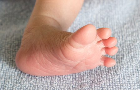 Little foot of newborn infantの写真素材