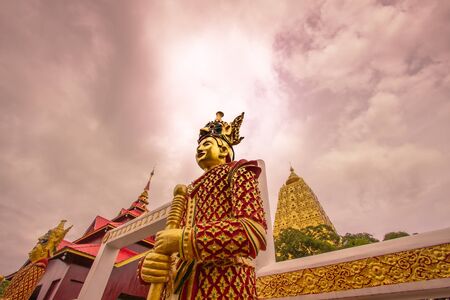 Mon style guard statue at the entrance of Puttakaya chedi(pagoda),Sangkhlaburi district,Kanchanaburi,Thailand.の写真素材