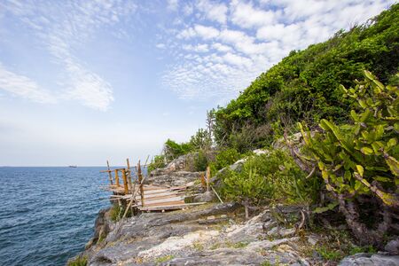 Bamboo fence on the cliff at Koh Sichang,Chonburi,Thailand.の写真素材
