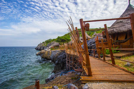 Bamboo bridge and Borneo style huts at Koh Sichang,Chonburi,Thailandの写真素材