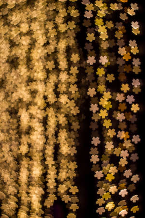 Sakura shaped bokeh of decorating  lights during Christmas and New Year Festivalの写真素材