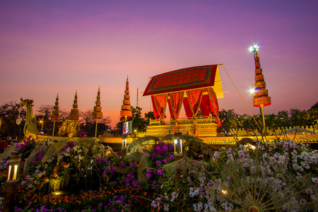 Royal winter festival,"Oon Ai Rak Klay Kwam Nao",at the Royal Plaza,Dusit Palace and Sanam Suea Pa,Bangkok,Thailand on February16,2018:Replica of Royal Barge Suphannahong with colorful flowers at the base.のeditorial素材