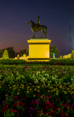 Royal winter festival,"Oon Ai Rak Klay Kwam Nao",Royal Plaza,Dusit Palace and Sanam Suea Pa,Bangkok,Thailand on February16,2018:Equestrian Statue of King Chulalongkorn and colorful flowers.のeditorial素材