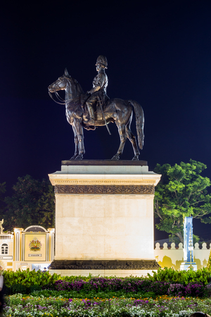 Royal winter festival,"Oon Ai Rak Klay Kwam Nao",Royal Plaza,Dusit Palace and Sanam Suea Pa,Bangkok,Thailand on February16,2018:Equestrian Statue of King Chulalongkorn and colorful flowers.のeditorial素材