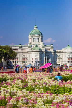 Royal winter festival,Un Ai Rak Khlai Khwam Nao,at Royal Plaza,Dusit Palace and Sanam Suea Pa,Bangkok,Thailand on March3,2018:Anantasamakhom Throne Hall and colorful flowers.のeditorial素材
