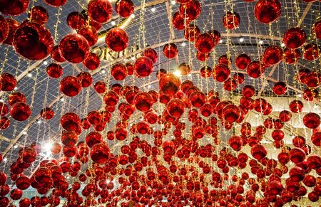 Emporium Shopping mall, Sukhumvit Road, Bangkok, Thailand on December 18, 2018 : Decoration with beautiful red balls at the entrance during Christmas and New Year Festivalのeditorial素材