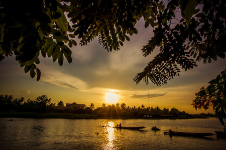 Golden sky above Tha Chin river(Maenam Tha Chin),Nakhon Pathom,Thailand during sunsetの写真素材