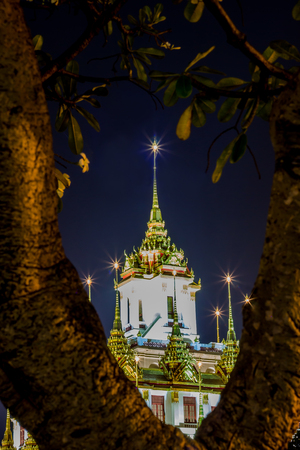 Night scene of Loha Prasat at Wat Ratchanaddaram Woravihara(buddhist temple located in Phra Nakhon district,Bangkok,Thailand. Also called the 'Metal Castle')のeditorial素材