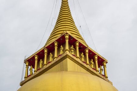 Great golden pagoda of Wat Prong Arkad in Amphoe Bang Nam Priao,Chachoengsao Province,Thailand.(close up)の写真素材
