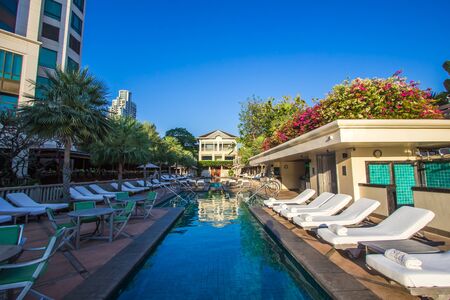 Bangkok, Thailand - February 18, 2019 : Beautiful landscape at the swimming pool of The Peninsula Bangkok Hotel by day.のeditorial素材