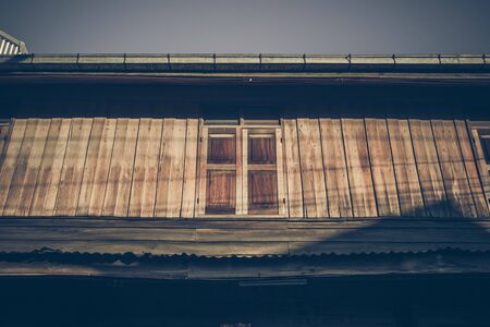 Old wooden houses along walking street(Chai Khong Road) in Chiang Khan,Loei,Thailand.Close-up the windows.の写真素材