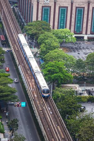 Bangkok, Thailand - August 10, 2019 : BTS Skytrain,Sukhumvit Line, passing Central Chidlom shopping mall building.のeditorial素材