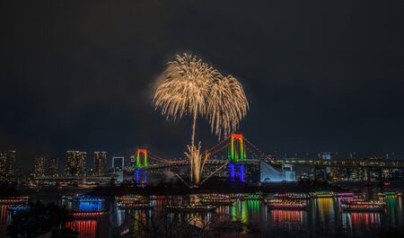 Odaiba, Minato, Tokyo, Japan on December 7, 2019 : Rainbow Bridge as a perfect backdrop for fireworks during Odaiba Rainbow Winter Fireworks 2019.のeditorial素材