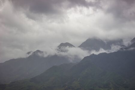 Morning fog,cloudy sky and mountain ranges in Sapa,Lao Cai Province,north-west Vietnam.の写真素材
