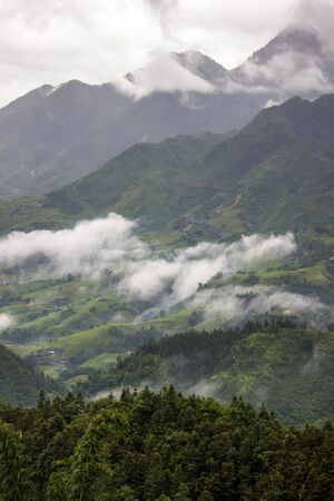 Morning fog,cloudy sky and mountain ranges in Sapa,Lao Cai Province,north-west Vietnam.の写真素材