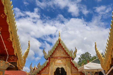Mae Hia,Chiang Mai,Northern Thailand on Septemmber 13,2019:Beautiful Lanna style roof at  Wat Phra That Doi Kham.のeditorial素材