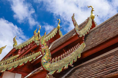 Mae Hia,Chiang Mai,Northern Thailand on Septemmber 13,2019:Beautiful Lanna style roof at  Wat Phra That Doi Kham.のeditorial素材