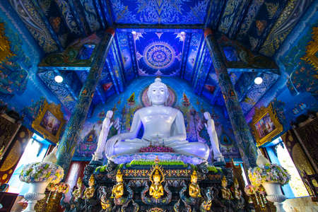 Rimkok district,Chiang Rai Province,Northern Thailand on January 19,2020:Large white Buddha image in subduing Mara at Wat Rong Suea Ten or Blue Temple.のeditorial素材