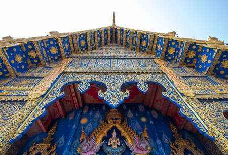 Chiang Rai Province,Northern Thailand on January 19,2020:Beautiful cobalt blue and gold facade of the main hall of Wat Rong Suea Ten or Blue Temple.のeditorial素材