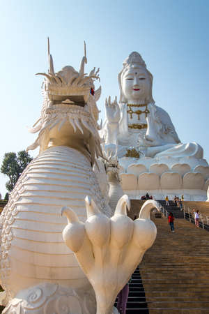 Rimkok district,Chiang Rai Province,Northern Thailand on January 19,2020:Enormous white Guan Yin Statue and beautiful dragon staircases at Wat Huay Pla Kang.のeditorial素材