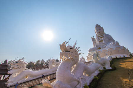 Rimkok district,Chiang Rai Province,Northern Thailand on January 19,2020:Enormous white Guan Yin Statue and beautiful dragon staircases at Wat Huay Pla Kang.のeditorial素材
