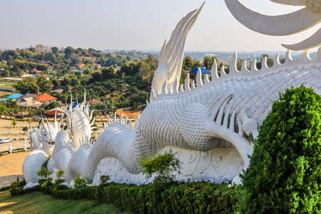 Rimkok district,Chiang Rai Province,Northern Thailand on January 19,2020:Beautiful white dragon sculptures along the staircases leading to large Guan Yin image at Wat Huay Pla Kang.のeditorial素材