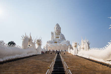 Rimkok district,Chiang Rai Province,Northern Thailand on January 19,2020:Enormous white Guan Yin Statue and beautiful dragon staircases at Wat Huay Pla Kang.のeditorial素材