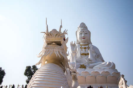 Rimkok district,Chiang Rai Province,Northern Thailand on January 19,2020:Enormous white Guan Yin Statue and beautiful dragon staircases at Wat Huay Pla Kang.のeditorial素材