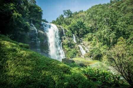 Strong flow with rain-like mist and rainbow in the spray of Wachirathan Waterfall in Doi Inthanon National Park,Chom Thong District,Chiang Mai province,Northern Thailand.の写真素材