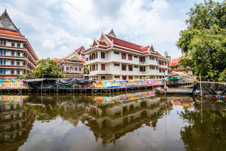 Phasi Charoen district,Bangkok,Thailand on May29,2020:Waterside scene with beautiful wall paintings along Phasi Charoen Canal at Wat Paknam Phasi Charoen.のeditorial素材