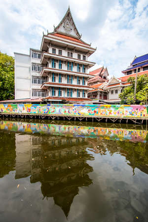 Phasi Charoen district,Bangkok,Thailand on May 29,2020:Waterside scene with beautiful wall paintings along Phasi Charoen Canal at Wat Paknam Phasi Charoen.のeditorial素材