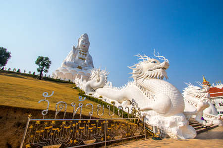 Rimkok district,Chiang Rai Province,Northern Thailand on January 19,2020:Enormous white Guan Yin Statue and beautiful dragon staircases at Wat Huay Pla Kang.のeditorial素材