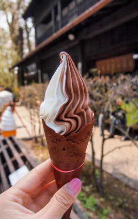 Soft serve is a type of ice cream that is softer than regular ice creams as a result of air being introduced during freezing. Soft serve ice cream has been sold commercially since the late 1930s.の写真素材