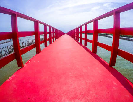 Red Boardwalk Bridge as a viewpoint near Matchanu Shrine,Samut Sakhon,Thailand.の写真素材