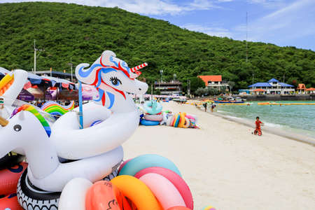 Koh Larn,Pattaya,Chonburi,Eastern Thailand on September 26,2020:Colorful swim rings on Tawaen Beach.のeditorial素材