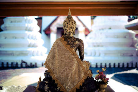 Taling Chan,Bangkok,Thailand on January8,2021:Buddha statue in front of the old chapel of Champa Temple.のeditorial素材