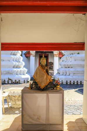 Taling Chan,Bangkok,Thailand on January8,2021:Buddha statue in front of the old chapel of Champa Temple.のeditorial素材