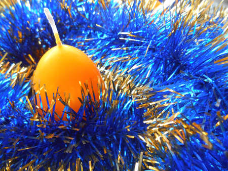 Christmas and New Year candle egg blue backgroundの写真素材