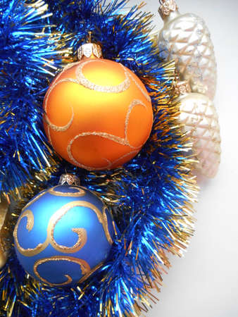 Christmas and New Year decoration balls on a blue tinsel backgroundの写真素材