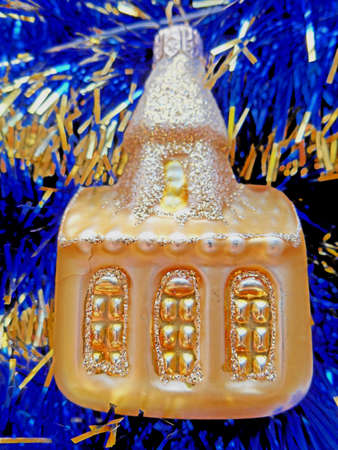 Christmas and New Year decoration golden house on a blue abstract backgroundの写真素材