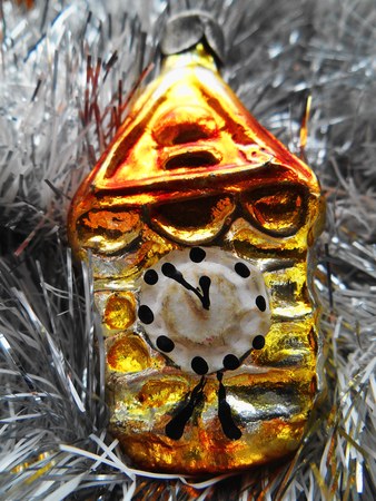 Christmas and New Year decoration golden clock on a silver backgroundの写真素材