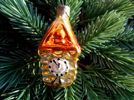 Christmas and New Year decoration gold watch on a background of green firtree の写真素材
