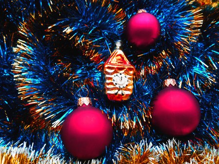 Christmas and New Year decorations red balls on a background of blue tinselの写真素材