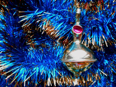 Christmas and New Year decorations on a background of blue tinselの写真素材
